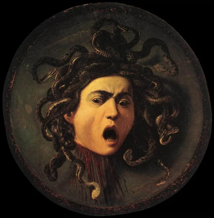 Cabeça de Medusa (1599). Caravaggio (1571–1610). Óleo sobre tela aplicada sobre disco de madeira - Galeria Uffi zi (Florença)